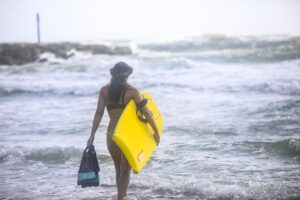 surfing body, boarding surfer