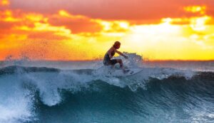 surfing sunset waves